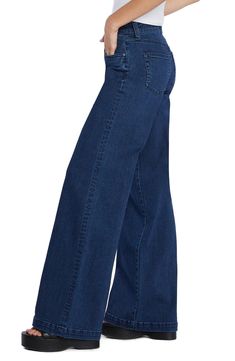 Effortlessly cool and casual-chic, these stretchy jeans flaunt a high waist and full-length wide legs that create a dramatic profile. 32" inseam; 23" leg opening; 10 1/4" front rise Zip fly with button closure Five-pocket style 71% cotton, 25% REPREVE® recycled polyester, 3% rayon, 1% spandex REPREVE recycled polyester is made from 100% post-consumer recycled plastic bottles Machine wash, tumble dry Imported Modern Mid-rise Blue Flare Jeans, Modern Blue Mid-rise Flare Jeans, Wide Leg Stretch Flare Jeans In Denim Blue, Stretch Wide Leg Flare Jeans In Denim Blue, Denim Blue Stretch Wide Leg Flare Jeans, Stretch Wide Leg Flare Jeans With Five Pockets, Versatile High Rise Dark Wash Flare Jeans, Versatile Relaxed Fit Full Length Flare Jeans, Stretch Wide Leg Cargo Jeans