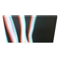 blurry photograph of colorful lines on black background