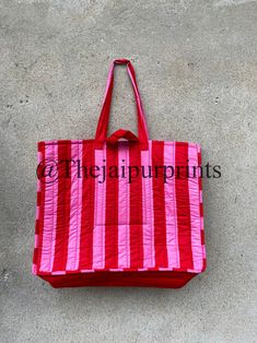 The Jaipur Prints  Red And Pink Stripe Quilted Cotton Tote Bag, Handmade Tote Bag, Indian Making Quilted Tote Bags, Cotton  Shoulder Bag, Women's Carry Bag The Indian Hand Block Printed Cotton Quilted Women's Handbags from Rajasthan India. This Handbag is completely Indian Printed on good quality cotton. Cotton quilted travel Bag made by Indian Artisans, this cotton quilted shopping bag is totally unique and multi purpose. Use this for your grocery or as a travel bag. Perfect to suit all. Item : Red Square Canvas Bag With Large Capacity, Large Capacity Red Square Canvas Bag, Red Rectangular Bag With Large Capacity, Large Capacity Red Rectangular Bag, Red Rectangular Box Bag With Large Capacity, Red Rectangular Shoulder Bag For Daily Use, Red Rectangular Shoulder Bag For Shopping, Red Large Capacity Box Bag For Daily Use, Red Rectangular Shoulder Bag For Travel