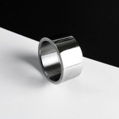 Wide polished steel ring band is a perfect jewelry gift idea for youth professionals. The ring adds a touch of modern elegance without overpowering the outfit, striking the perfect balance between professionalism and style.   𝐒𝐈𝐙𝐄: ➤ Unisex Standard US Ring Sizes 4-11  ➤ Width: 11mm (0.4″) ➤ Nickel Free, Hypoallergenic, Non Tarnish If you do not know your size, please read the FAQ (bottom of the page) or contact Rannka.  𝐃𝐄𝐓𝐀𝐈𝐋𝐒: ➤ Material: Polished Stainless Steel  Nickel Free, Lead Casual Meeting, Rings Minimalist, Jewelry Casual, Ring Bands, Casual Rings, Womens Rings Fashion, Wide Band Ring, Everyday Ring, Leather Ring