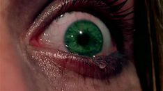 the eye of a woman with green eyes