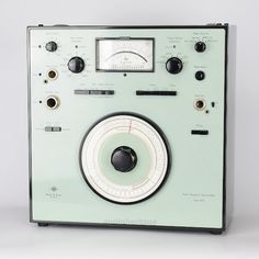 an old radio sitting on top of a table