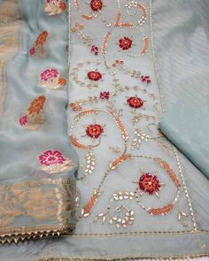 Item Overview ATHARVA Hand Embroidered Salwar Kameez/Grayish Blue Chanderi Silk/Colorful Meenakari Banarsi Dupatta/Customized Stitching/Wedding CH1714 Fabric: * Shirt: Chanderi Silk 2.5 Mts, with Beautiful Embroidery Front Panel * Dupatta:Meenakari Banarsi Dupatta/Colorful Motifs (Motifs May Wary) * Salwar: Santoon Silk 2.5 Mts. Excusive Hand Embroidered Party Wear Punjabi Suit. Customization: * Fabrics Customization: Designs Can be made in different Fabrics. *Color Customization: Designs Can be Festive Blue Tissue Silk Salwar Kameez, Transitional Blue Salwar Kameez With Floral Embroidery, Blue Tissue Silk Unstitched Suit For Eid, Blue Tissue Silk Salwar Kameez With Zari Work, Festival Blue Tissue Silk Salwar Kameez, Traditional Anarkali Set With Floral Embroidery In Tissue Silk, Blue Tissue Silk Salwar Kameez For Eid, Designer Blue Tissue Silk Salwar Kameez, Bollywood Silk Churidar With Floral Embroidery