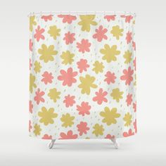 a shower curtain with yellow and pink flowers on it