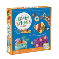 the kitty kitchen snacks box is filled with colorful treats and desserts on display