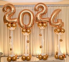 balloons and streamers decorate the entrance to a new year's eve party