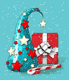 a blue christmas hat with red and white stars on it next to a gift box