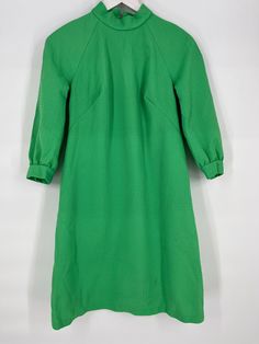 Bust 36", Waist 35", Hips 41", Length 36.5". Needs to be carefully washed before wear - we DO NOT launder. Staining on bottom of skirt. No tags. See pictures. Green Vintage Dress For Fall, Retro Long Sleeve Lined Vintage Dress, Retro A-line Vintage Dress, 1970s Green Long Sleeve Dress, 1970s Style Green Long Sleeve Dress, Vintage Green Dress For Work, 70s Green, Mock Neck Dress, Vintage 60s