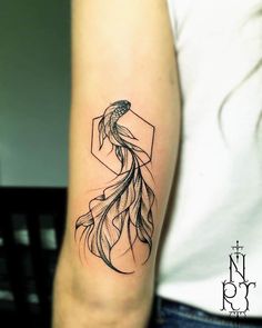 a woman's arm with a black and white tattoo design on the left forearm