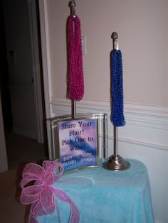 there are two candles with beads on them and a sign that says share your flair to pick one to win