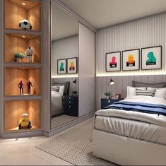 a bedroom with a bed, shelves and pictures on the wall next to each other