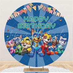 an image of a happy birthday sign with cartoon characters on it and confetti streamers in the background