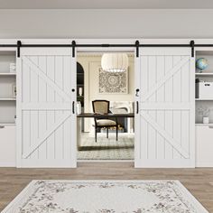 a living room with sliding barn doors and rug