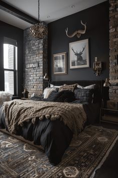 a large bed in a bedroom next to a window with deer heads on the wall