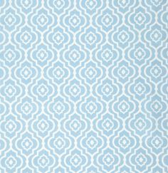 a blue and white wallpaper with circles on it