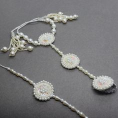 Beautiful White Pearl Sequin Beaded Hath Phool & Bracelet Bhaiya Bhabhi Rakhi Designed with the heart, this beautiful rakhi are made of premium material. Embroidered art work. Rakhi 2 Pcs Set. Rakhi For Bhaiya Bhabhi( tie loop, lumba) Rakhi For Brother, Rakhi Gifts, Rakhi, Rakhi, Brother Latest Rakhi, Designer Rakhi, Send Online Rakhi To Brother We welcome wholesale quires and all feedback. Bhaiya Bhabhi Rakhi Design, Traditional White Bracelets For Puja, Beads Rakhi Designs, White Bracelets For Puja And Festivals, White Bracelets For Puja And Festive Occasions, Festive White Bracelets With Latkans, Traditional White Bracelets For Festivals, White Spiritual Jewelry For Party, Adjustable Bollywood Bracelets For Puja