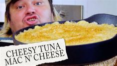 a man making a funny face in front of a pan of macaroni and cheese