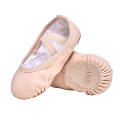 a pair of pink ballet shoes sitting on top of each other's soles