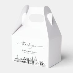 a small white box with the words thank you written in black ink on it's side