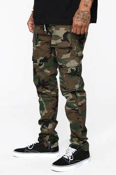 Available In Black, Khaki, Olive, Burgundy And Camo Button Closure Drawcord Zip Fly Side Hand Pockets Cargo Pockets Ankle Zip Skinny Fit 31 Inseam Disclaimer: Print Placement Will Vary. 98% Cotton 2% Spandex Imported | Mens Hunter Cargo Pants in Camouflage size 34 by Fashion Nova Tommy Clothes, Cargo Pants Camo, Slim Cargo Pants, Camouflage Fashion, Man Hunter, Camo Men, Camo Fashion, Camo Cargo Pants, Mens Pants Fashion