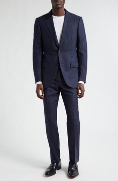 Incredibly high-thread-count wool—named for the Italian word for 120,000—lends a luxurious feel to this impeccable suit patterned with subtle stripes. Meticulous pickstitching showcases the label's scrupulous attention to detail. Jacket has notched lapels; chest welt pocket; front flap pockets Trousers have zip fly with hook-and-bar closure; front slant pockets; back welt pockets 100% wool Dry clean Made in Italy Designer Clothing Tailored Designer Business Sets, Designer Tailored Business Sets, Designer Tailored Sets For Business, Designer Notch Lapel Suits With Concealed Placket, Designer Tailored Suits With Suit Collar, Designer Suits With Notch Lapel And Concealed Placket, Tailored Luxury Wool Suit, Luxury Tailored Wool Suit, Elegant Business Suits With Structured Boning