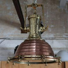 an antique light fixture hanging from the ceiling