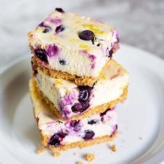 blueberry cheesecake bars stacked on top of each other