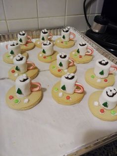 there are many decorated cookies on the tray