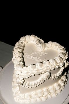 a heart shaped cake sitting on top of a white plate