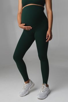 Our Cloud II Maternity Pant is designed for the ultimate comfort whether you are enjoying your workout of the day or stopping by your favorite coffee shop. This pant offers medium support and compression to accentuate your assets. Athleisure Bottoms With Support, Supportive Sporty Bottoms For Pilates, Sporty Supportive Yoga Bottoms, Fitted Bump Friendly Leggings For Gym, Athleisure Bump Friendly Leggings For Pilates, Bump Friendly Athleisure Leggings For Pilates, Athleisure Workout Bottoms Bump Friendly, Compressive Bump-friendly Workout Leggings, Maternity Athleisure Activewear For Sports