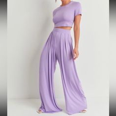 This Fashionable 2-Piece Outfit Will Have Anyone Looking And Feeling So Great In Their Body While Wearing It. It’s Beautiful Purple Color Will Allow You To Style It With Any Leather Or Cropped Jacket. Casual High Waist Two-piece Set, Casual High-waisted Two-piece Set, Casual Two-piece High Waist Set, High Waist Two-piece Loungewear Set, Casual High Waist Matching Set, Casual High-waisted Matching Sets, Casual Solid Two-piece Bottoms, Trendy Two-piece Solid Color Bottoms, Trendy Stretch Wide Leg Sets