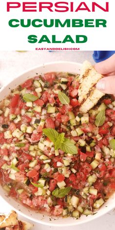 a white bowl filled with cucumber salad and garnished with basil leaves