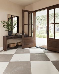 a room with a checkered floor and two doors that lead to the outside patio