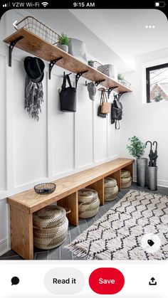 an entryway with pots and pans hanging on the wall next to a bench