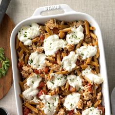 a casserole dish filled with pasta and meat