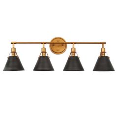 an antique brass finish bathroom light with three black shades on the arm and two white lamps