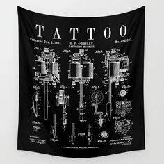 a black and white wall hanging with an old style tattoo machine on it's side