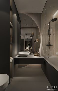 a modern bathroom with black and white walls, flooring and lights on the ceiling