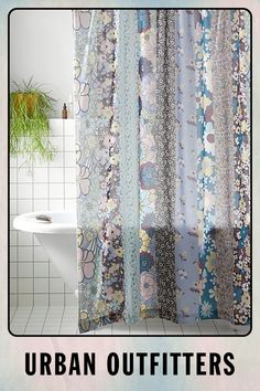 a shower curtain with flowers on it and the words urban outfitters