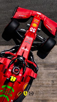 a red race car with the number 59 on it's front wheel is seen from above