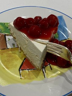 a piece of cheesecake with cherries on top