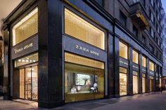 a store front with the windows lit up at night