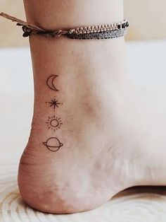 a woman's foot with two small tattoos on the side of her body and an ankle