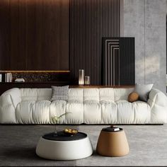 a living room filled with white furniture and lots of wood paneling on the walls