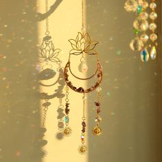 the sun shines brightly in front of a wall with jewelry hanging from it