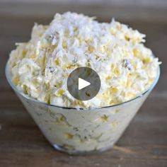 a bowl filled with food sitting on top of a wooden table