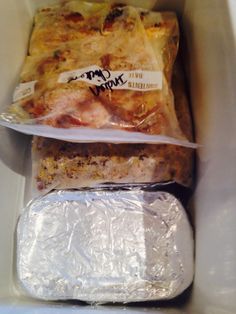 some food wrapped in plastic sitting inside of a container