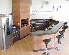 a modern kitchen with an island and stainless steel appliances