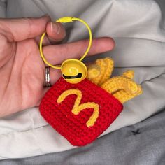 a crocheted key chain with a mcdonald's bag charm