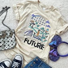 a t - shirt with the words future on it next to two pairs of shoes